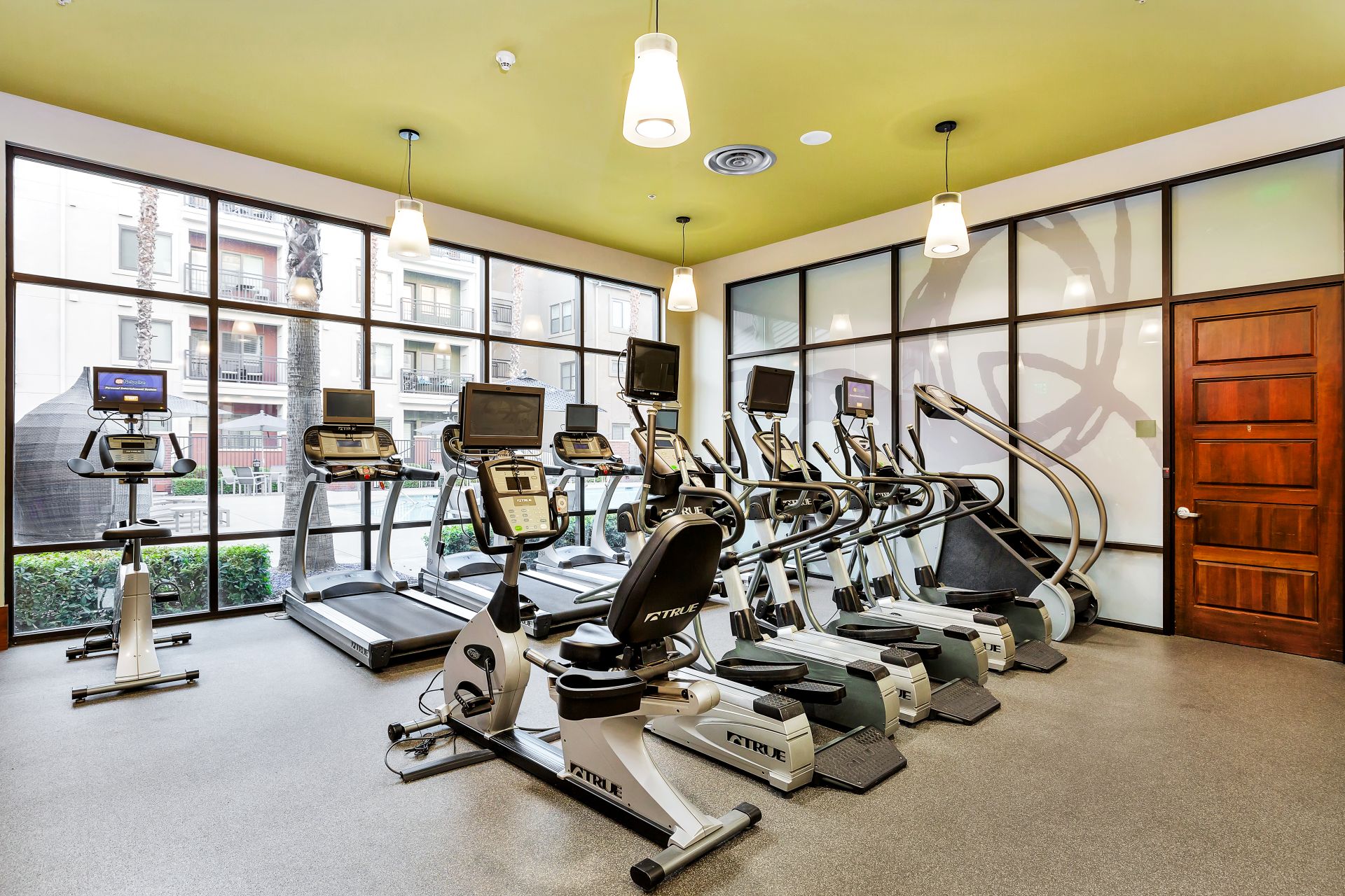 Fitness Center width recumbent bikes and treadmills - thumbnail of larger image